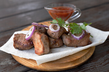 Delicious kebabs with vegetables and pita bread on a wooden table