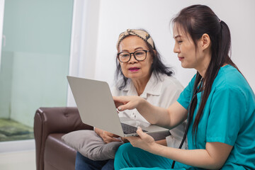 Asian female doctor explaining to educate medical Information about life planning with senior patient