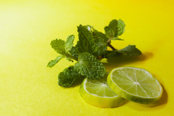 Lemon slices and min leaves kept together during summer season. These veggies have many health benefits.