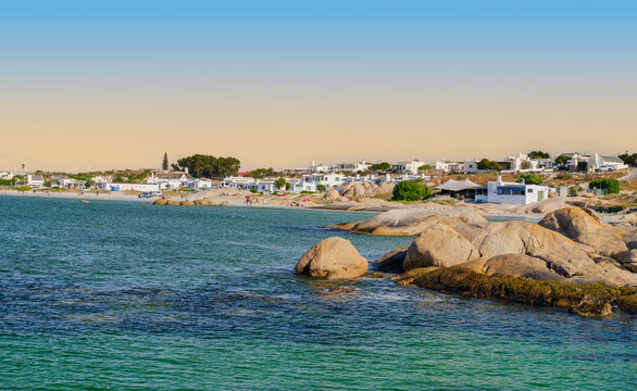 Panorama shot of Paternoster village and the beach with boulders on a blue sky afternoon, Paternoster, South Africa