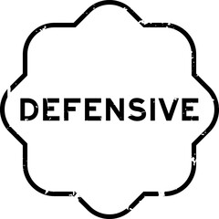 Grunge black defensive word rubber seal stamp on white background