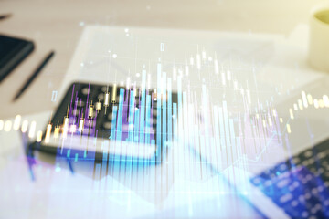 Abstract virtual financial graph hologram on blurry calculator and computer background, financial...