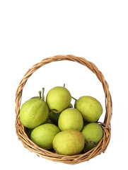 A basket of green fresh fruit pears