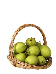 A basket of green fresh fruit pears