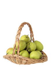 A basket of green fresh fruit pears