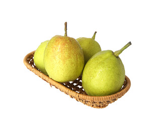 A basket of green fresh fruit pears