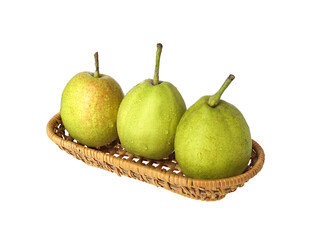 A basket of green fresh fruit pears