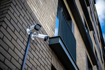 Surveillance camera for mounted on outside wall of Modern building. The concept of surveillance and...