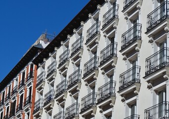 Old-fashioned vintage facade with balconies. Traditional Spanish architecture from downtown Madrid, Spain