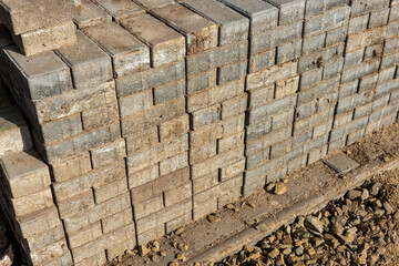 Old gray rectangular paving stones stacked