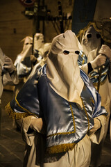 Hooded penitents during the famous Good Friday procession in Chieti (Italy) - 778979614