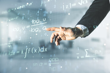 Man hand working with abstract scientific formula hologram on blurred office background....