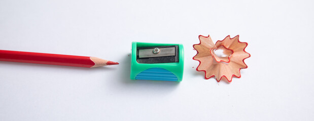 A pencil sharpener with a pencil and pencil shavings.