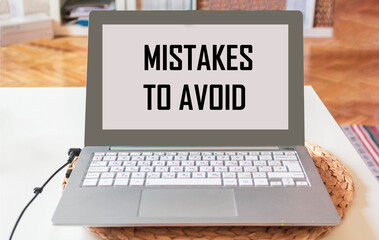 Notebook with the text Mistakes to avoid at home. Can be used as a concept photo.
