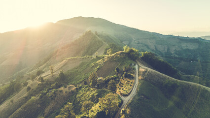 Aerial view of mountain and roadway, Beautiful landscape sunset with .golden sunlight.