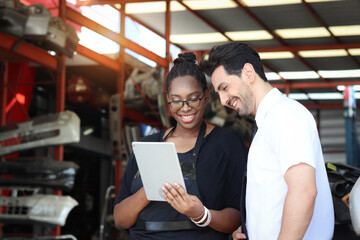 Happy harmony people at workplace, smiling white guy and African American woman working together...