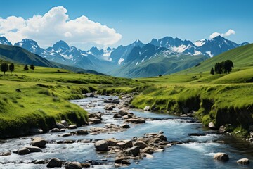 The river flows through the valley with snow-capped mountains in the distance - obrazy, fototapety, plakaty
