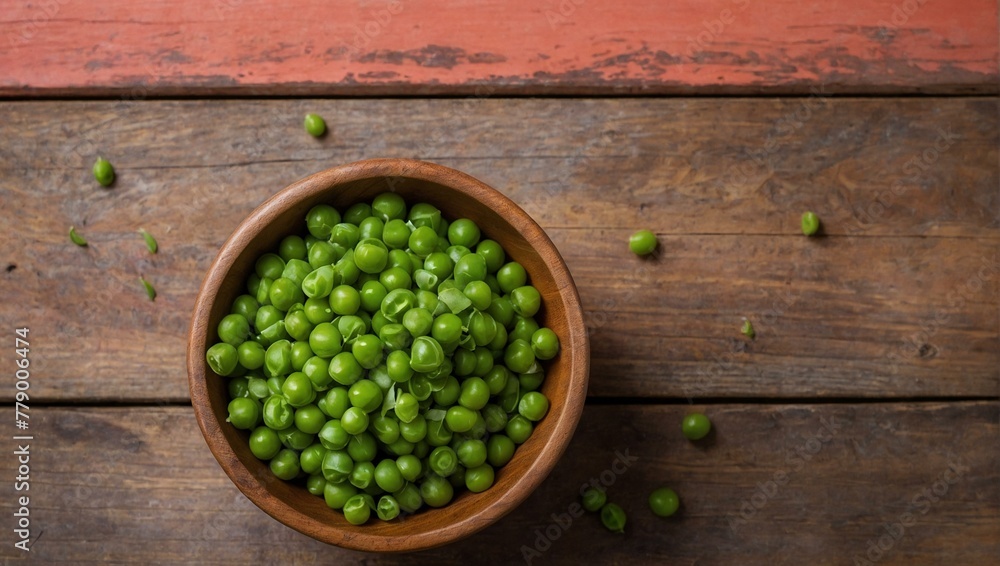 Wall mural a rustic wooden bowl filled with bright green peas sits atop a contrasting red wooden table, evoking