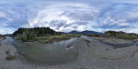 360 Aerial View of the River and Mountains. Dramatic Cloudy Sky.