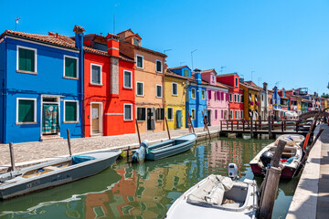 Colorful houses in a canal street houses of Burano island, Venice, Italy - 779006479