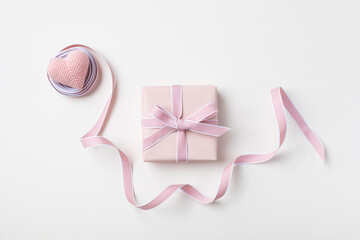 Holiday concept greeting card for Birthday, Woman or Mothers Day. Pink heart, ribbon and gift box top view. Flat lay. - 779023072