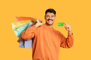 Man with shopping bags and credit card - obrazy, fototapety, plakaty