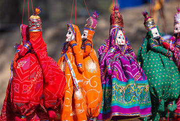 Indian colorful Rajasthani handmade Puppets and Crafts products at fair. Selective focus.