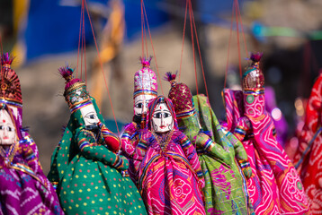 Indian colorful Rajasthani handmade Puppets and Crafts products at fair. Selective focus. - obrazy, fototapety, plakaty