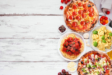 Delicious Italian food side border. Group pizzas and pastas. Top down view on a white wood background. Copy space.