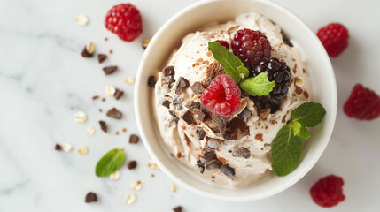 Luxurious ice cream with raspberries and chocolate pieces, an ideal image for dessert menus or...