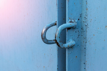 welded eyelets made of bar for a padlock on the gate