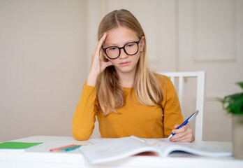 Teen Girl Studying at Home During Daytime, Making Homework