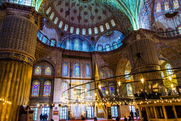Fototapeta na wymiar Istanbul, Turkey - March 23 2014: The splendid mosaic tiles decorated dome in Blue Mosque in Istanbul