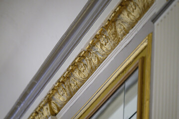gold crown molding with flowers and leaves