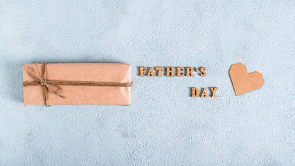 Father's day craft gift, cardboard heart and inscription on a blue background web banner