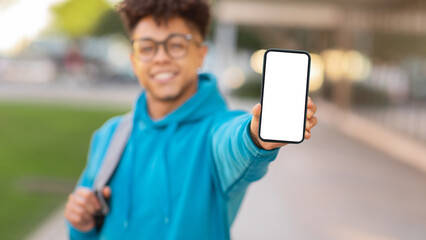 Blurred image of student with phone, copy space