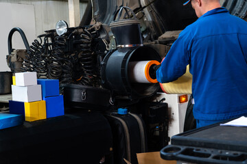 Truck repair service indoors. Maintenance workshop.