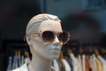 closeup of sun glasses on mannequin in a fashion store showroom