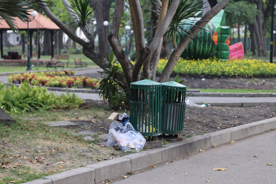 Trash cans outside park in Saigon, Vietnam on March 4, 2024