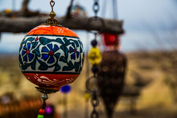 Göreme, Turkey - March 21 2014: Clorful Glass lampshade with background of Cone shaped Rock...