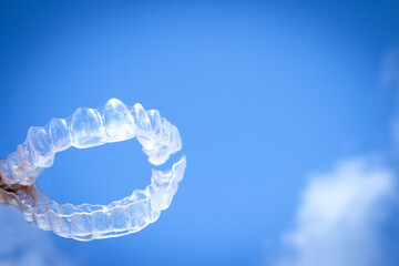 Invisible teeth aligner on light background