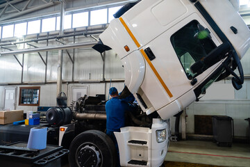 Truck repair service indoors. Maintenance workshop.