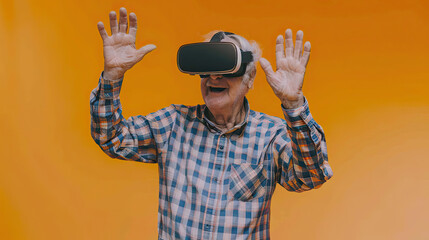 Waving Senior man wearing VR headset on orange background