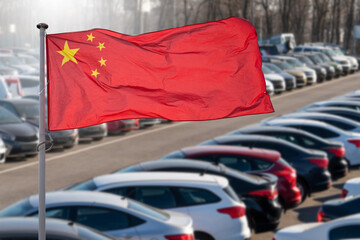 Chinese flag on a background of a lot of cars.
