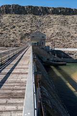 Walkway with handrail leads to the controller of a diversion dam