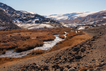 Beautiful sunny autumn landscape of the steppe with a river