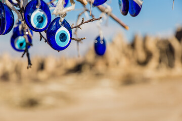 Göreme, Turkey - March 21 2014: Evil eye with background of fairy Chimneys in Dove Valley of...