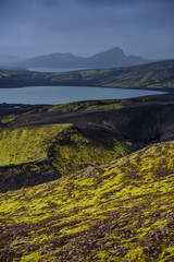 A dark, midday view of the rugged and remote highlands from the top of Laki volcano, Lakagígar crater row, Iceland.