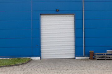 Industrial Shutter Door on Blue Wall