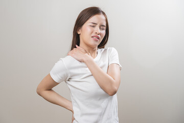 Obraz premium Pain body muscles stiff problem, asian young woman, girl painful with back, neck ache from work hand holding massaging rubbing shoulder hurt, sore on white background. Health care and medicine concept
